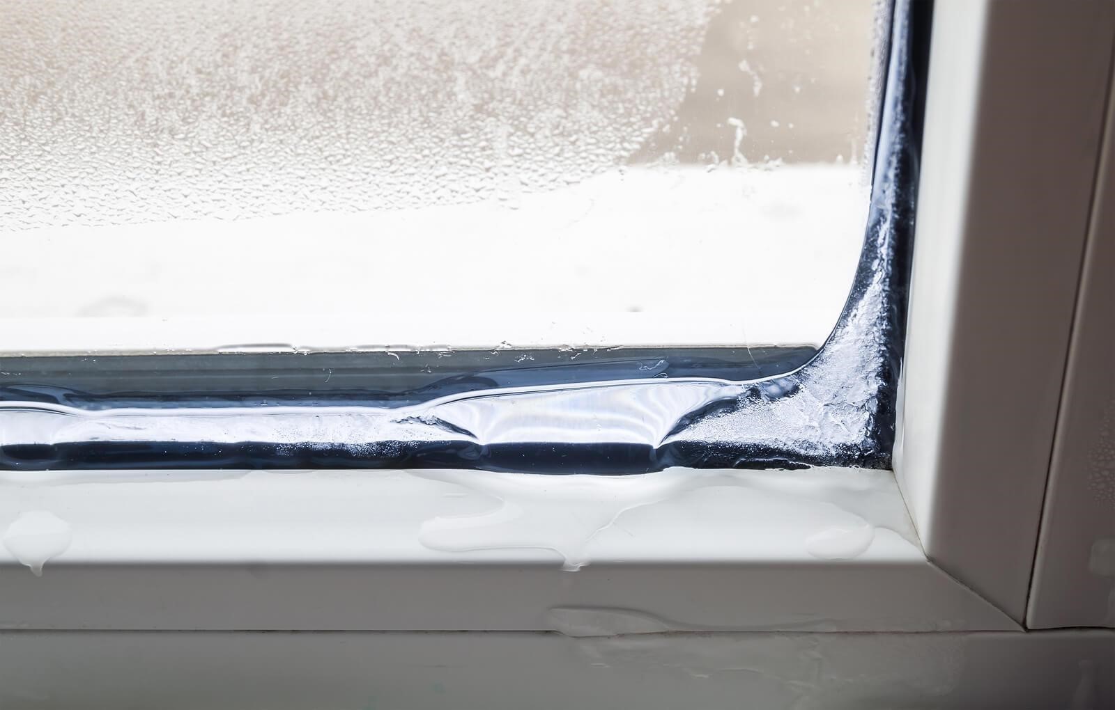 Frost build-up on window indoors